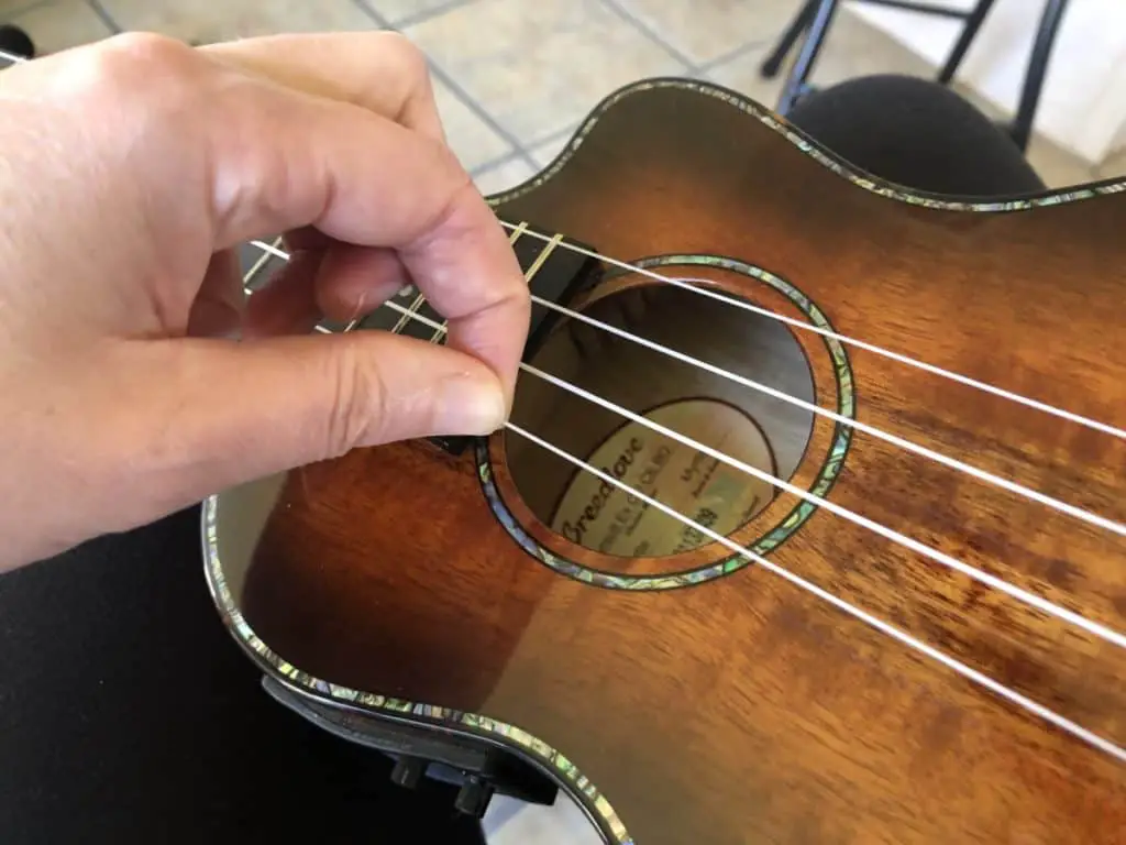 Pulling a ukulele string